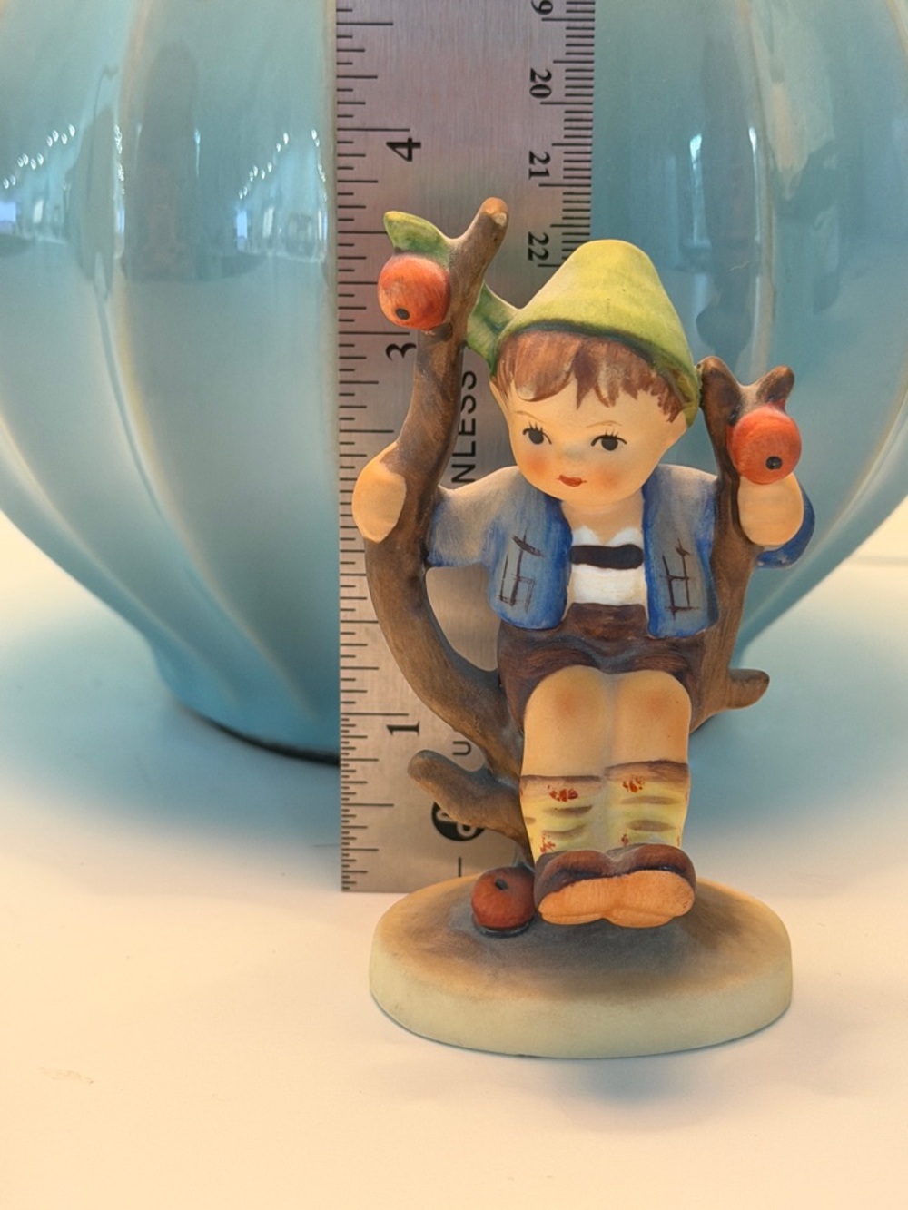 Hand-Painted Ceramic Boy on Swing Figurine in Blue and Green